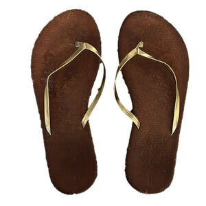 Brown lightweight flip-flops with gold straps